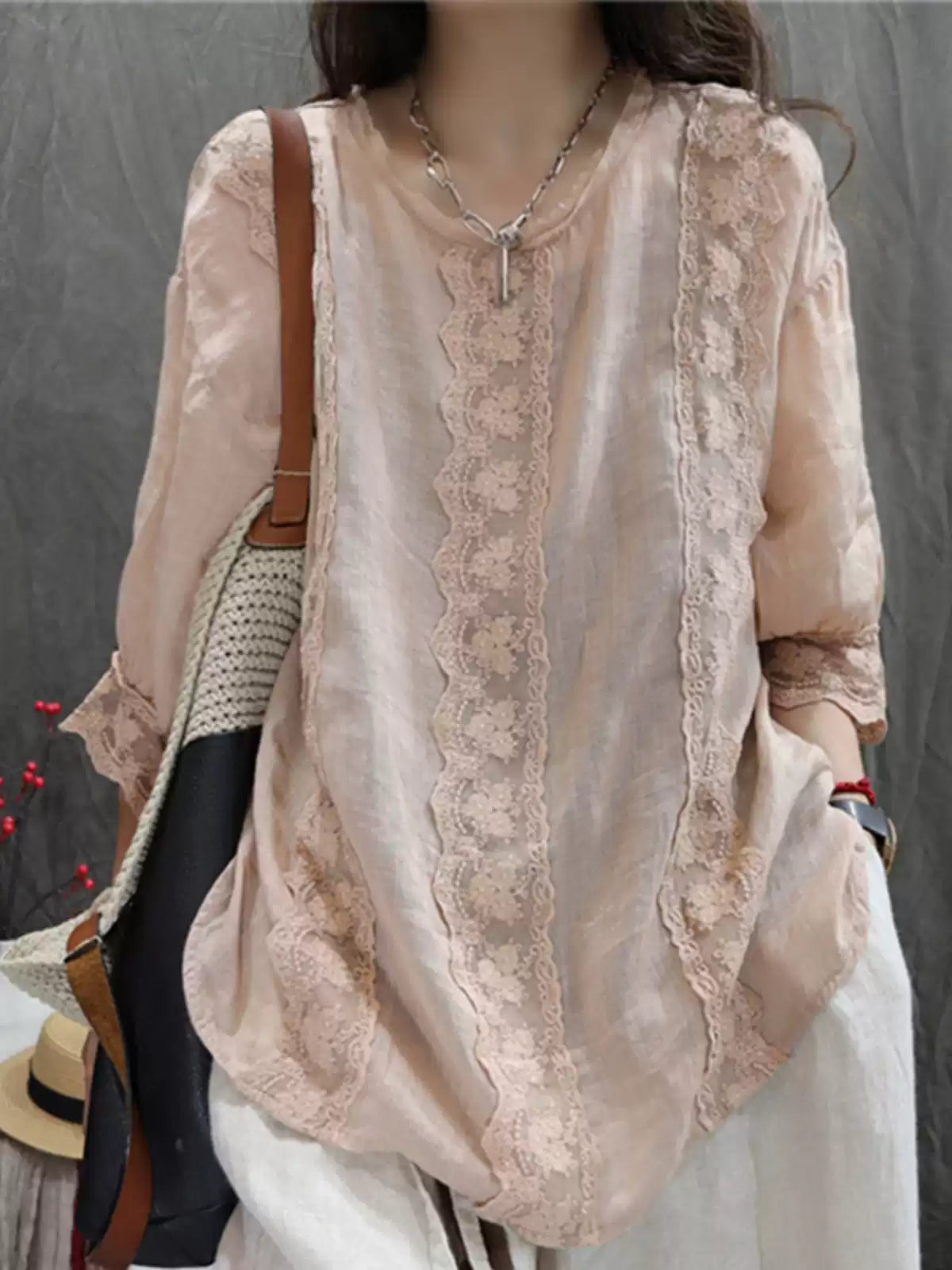 Woman wearing ramie lace trim blouse styled casually