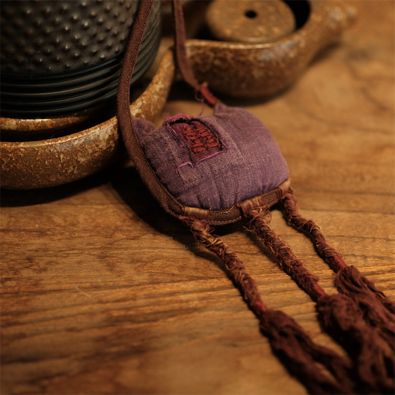 Purple washed linen embroidered accessory front view