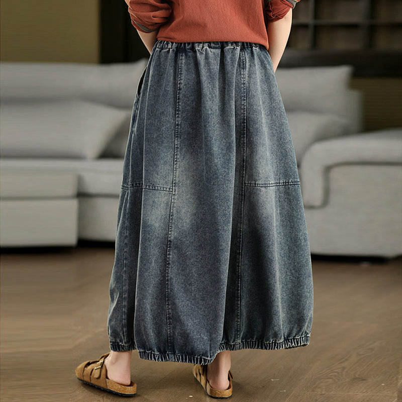 Back view of washed denim A-line skirt with a relaxed shape