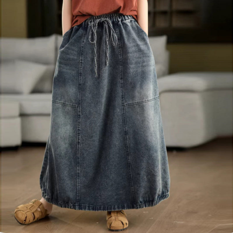 Close-up of washed denim skirt showing soft texture and washed finish