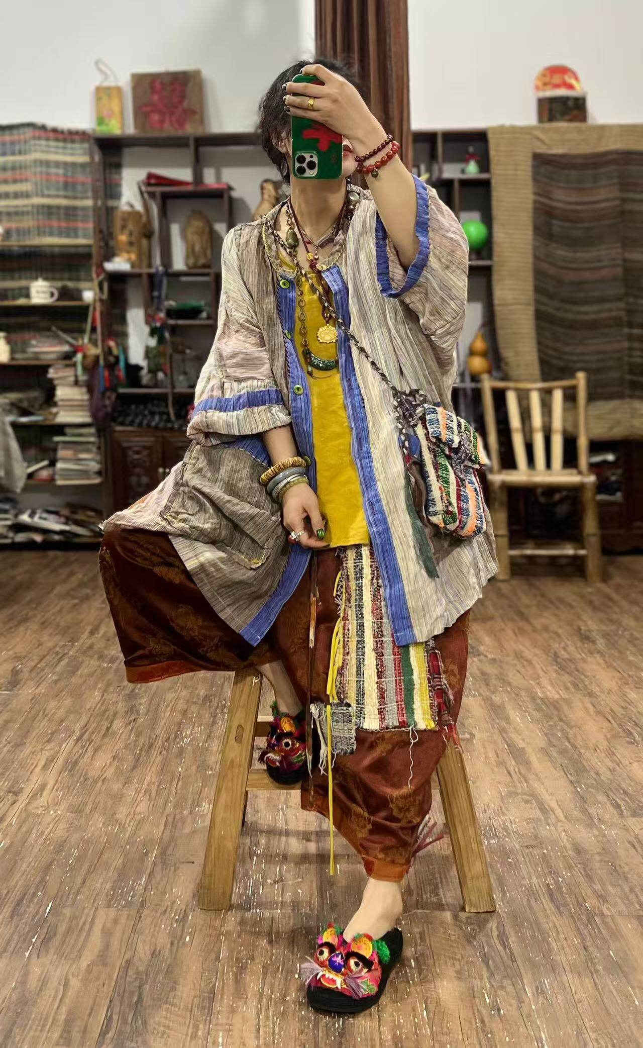 Woman wearing yarn-dyed linen striped jacket styled casually